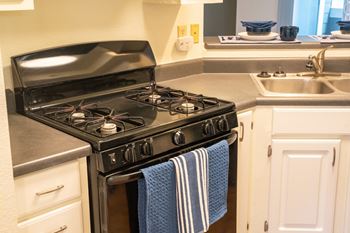 a kitchen with a stove and a sink